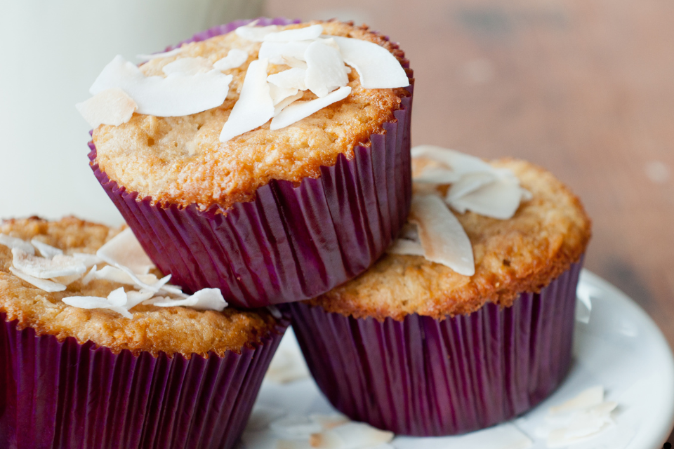 Delicious cup cakes topped with coconut flakes